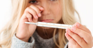 cropped-close-up-portrait-sick-sad-crying-little-girl-holding-thermometer-scaled-2.jpg